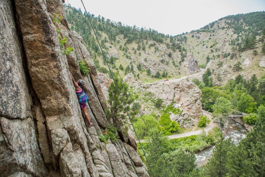 middle schooler rock climbing