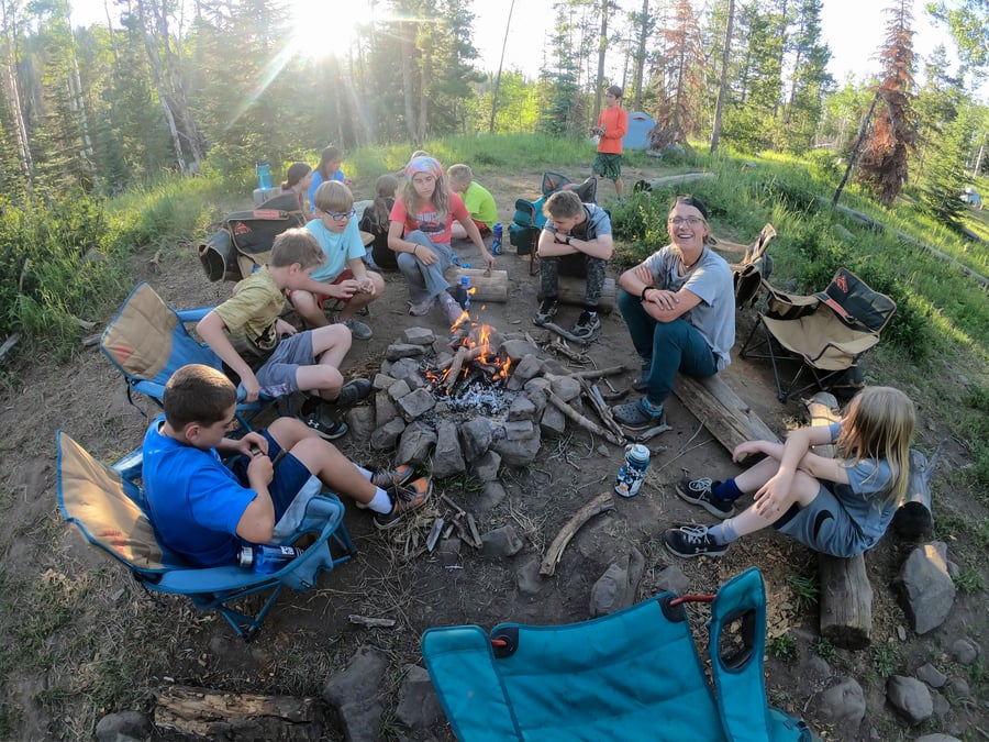 overnight camp counselor around the campfire