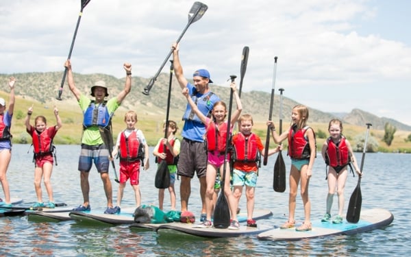 kids stand up paddleboarding summer camp