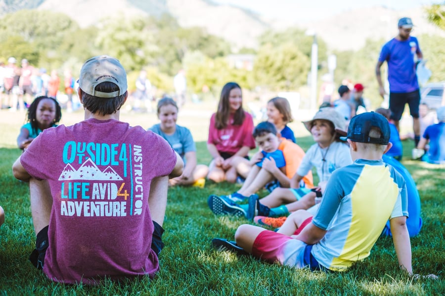 outdoor educator with a group of kids