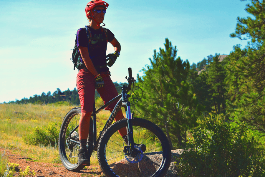 female mountain biking instructor taking a rest break