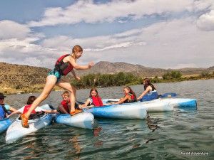 girl-walking-kayaks