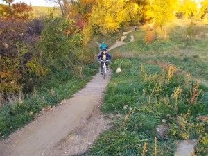 kid-biking-on-trail